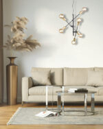 Beige modern interior with a frame and a brass floor vase