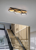 This beautiful wooden staircase is located in the middle of a la