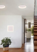Apartment entrance hall with wooden staircase access to upper fl